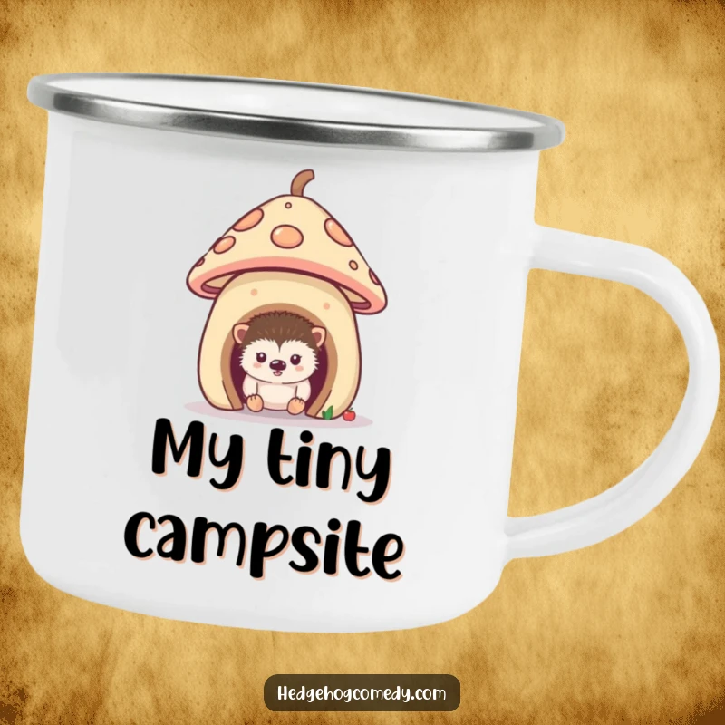 Funny camping mug showing a curious hedgehog peeking from its mushroom home, ideal for enjoying beverages during woodland escapades.