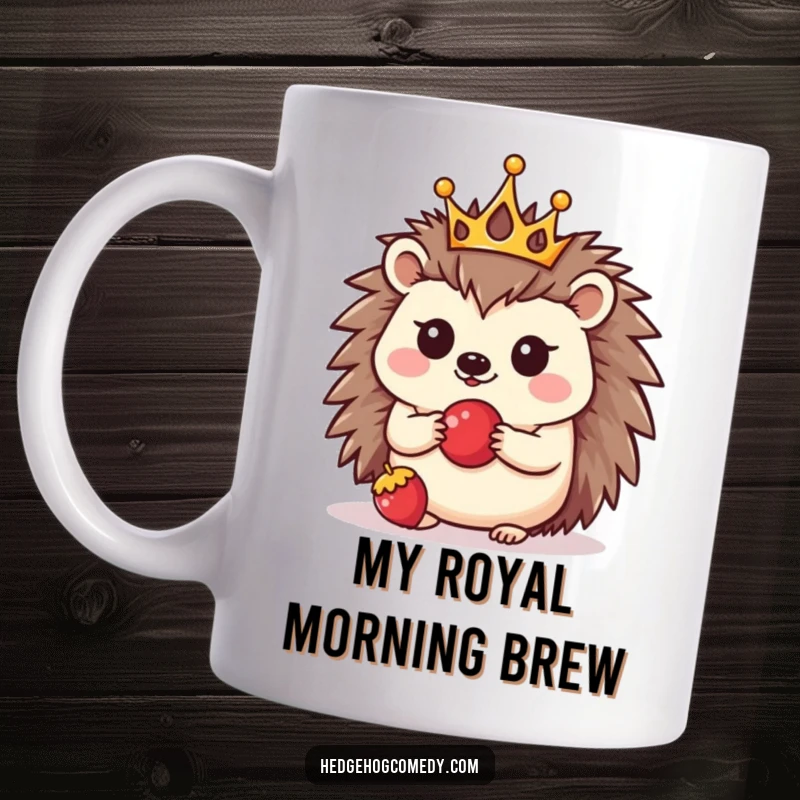 Funny mug featuring a kawaii hedgehog wearing a tiny golden crown, balancing a red berry on its nose, looking absolutely precious.
