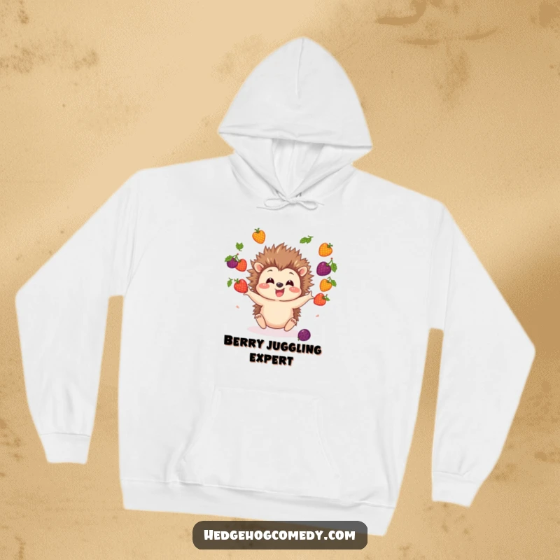 Funny Hedgehog Hoodie showcasing an adorable hedgehog character juggling a medley of colorful berries with visible excitement.