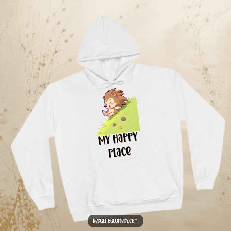 Funny, comfortable hoodie showing a hedgehog sliding down a green slope with immense joy, perfect for active and fun-loving individuals.