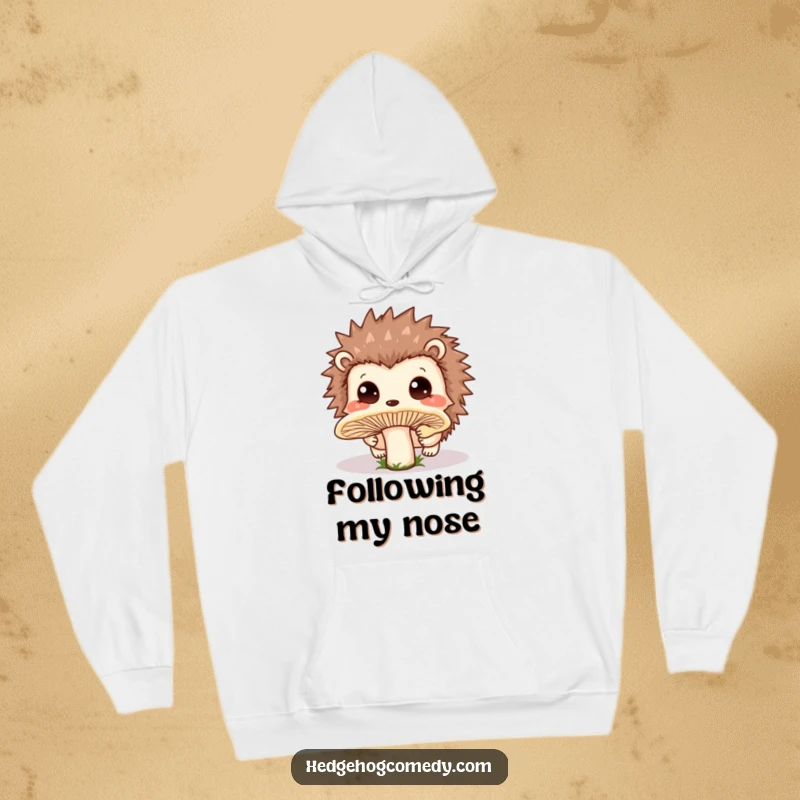 Funny Hoodie with a charming Kawaii hedgehog curiously sniffing a large mushroom, surrounded by a gentle, dewy forest.