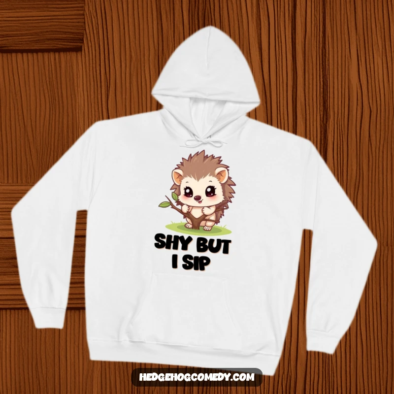 Funny hoodie featuring a hedgehog character peeking from behind a twig. Warm, comfortable, and full of playful charm.