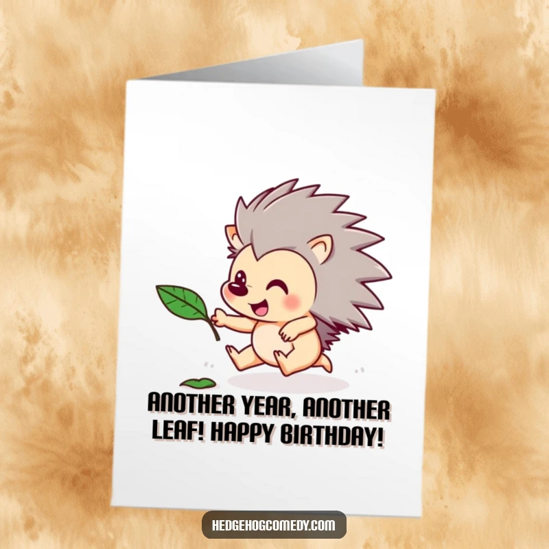 Funny Free Printable Birthday Card illustrating a hedgehog gleefully chasing a floating leaf, capturing pure, joyful energy.