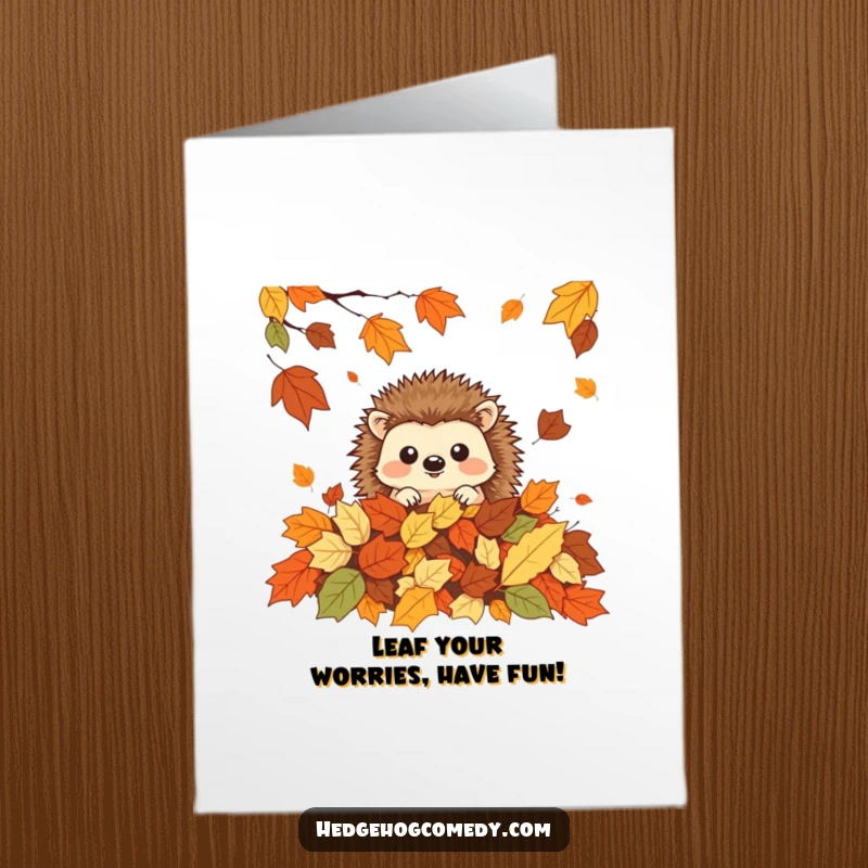Funny Free Printable Birthday Card: A playful kawaii hedgehog peeking out from a colorful pile of autumn leaves.