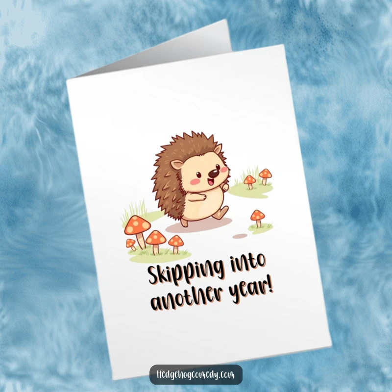 Funny Free Printable Birthday Card showing a cheerful hedgehog happily skipping along a path adorned with tiny mushrooms.