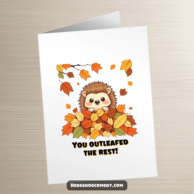 Funny Free Printable Congratulations Card: A cute kawaii hedgehog peeking from autumn leaves, celebrating accomplishments.