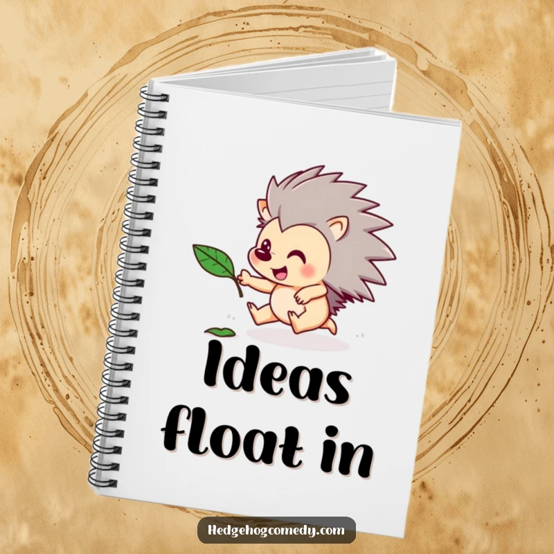 Funny notebook cover with a hedgehog character excitedly chasing a floating leaf. Playful and humorous stationery.