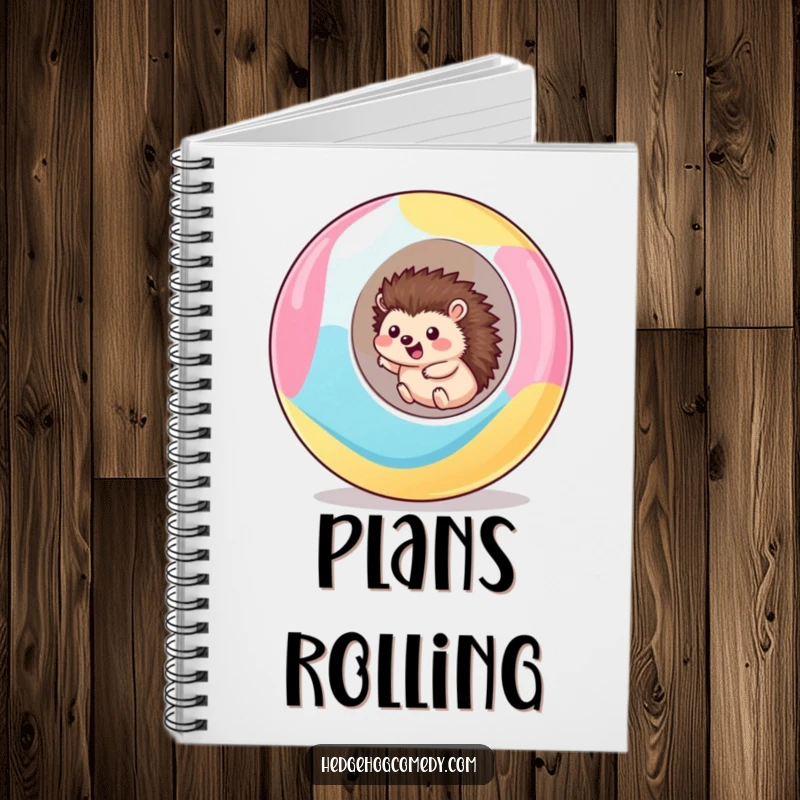 Funny kawaii hedgehog notebook featuring a cute hedgehog excitedly rolling downhill inside a giant, colorful ball, perfect for note-taking.