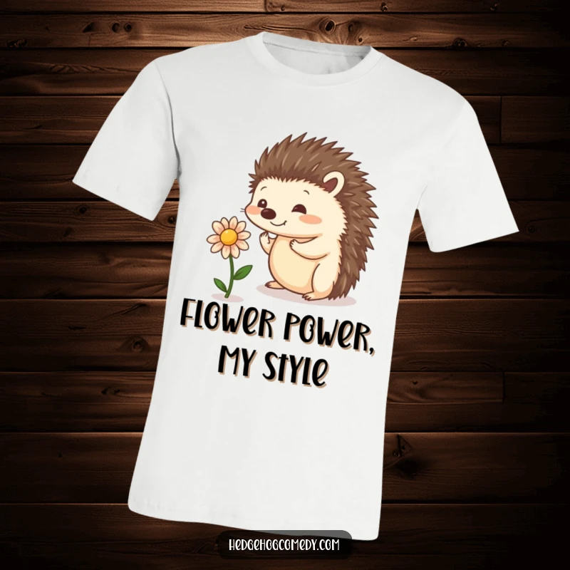 Funny t-shirt showcasing a playful hedgehog attempting to balance a tiny flower, perfect for nature lovers and those who appreciate cute art.
